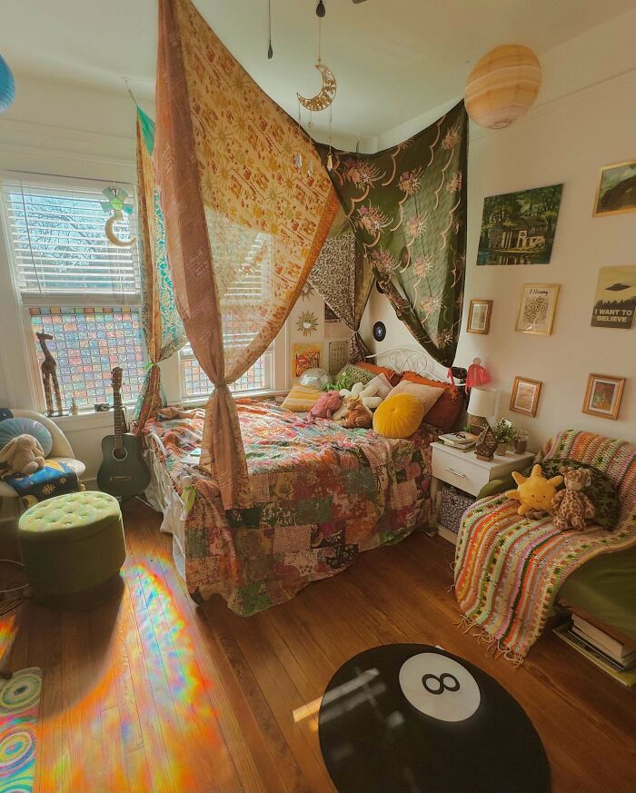 Cozy bohemian bedroom showcasing more is more decor with vibrant patterns, layered fabrics, and eclectic home accessories.