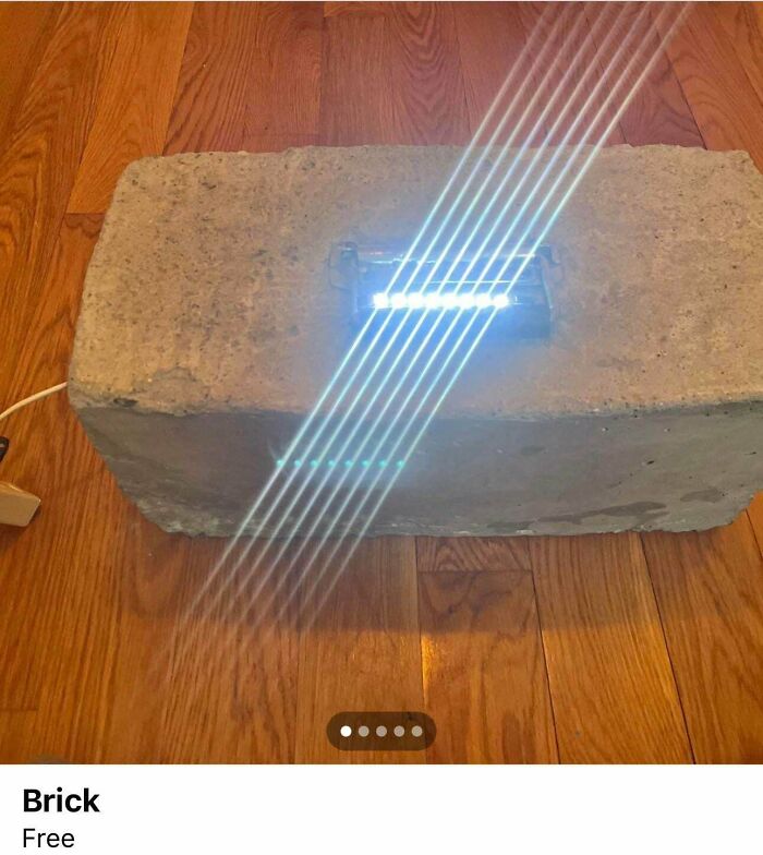 Concrete brick DIY project with unusual LED light installation creating bright light streaks on wooden floor.
