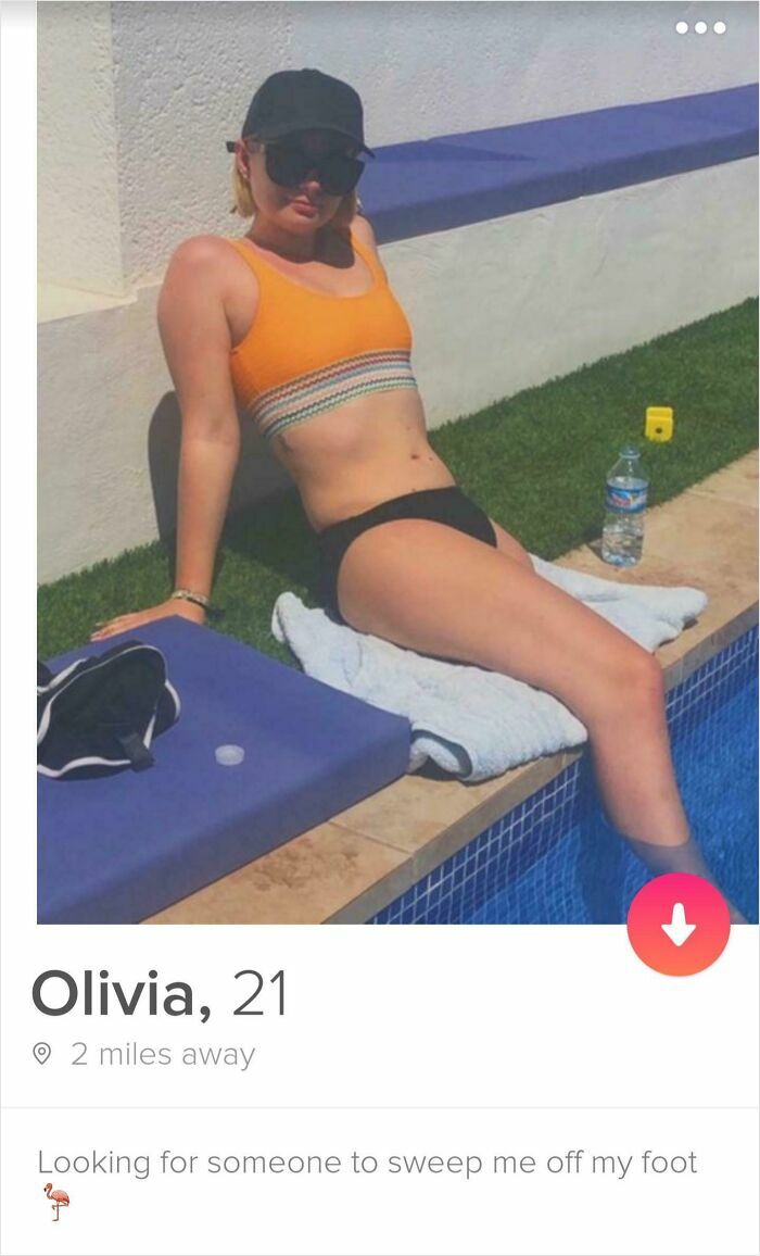 Young woman in orange top and black bottoms lounging by pool in a quirky Tinder profile from 54 Tinder profiles off the rails.