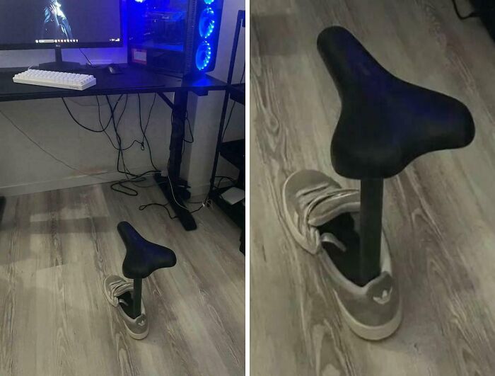 DIY project gone wrong with a bike seat awkwardly attached to a sneaker standing on a wooden floor near a desk.