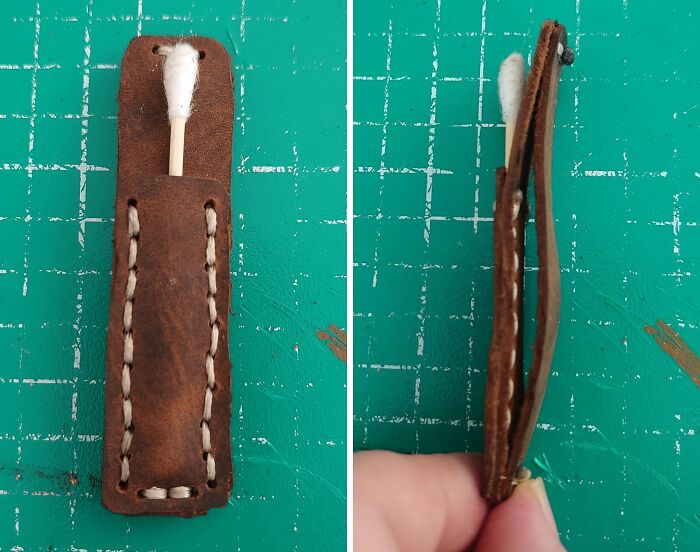 Leather DIY project with a cotton swab holder stitched on a green cutting mat, showing a deeply cursed handmade craft.