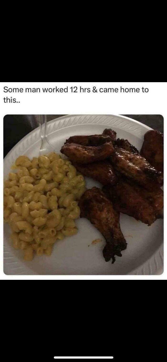 A plate of macaroni and cheese with chicken wings, with text saying a man worked 12 hours and came home to this, explaining the joke.