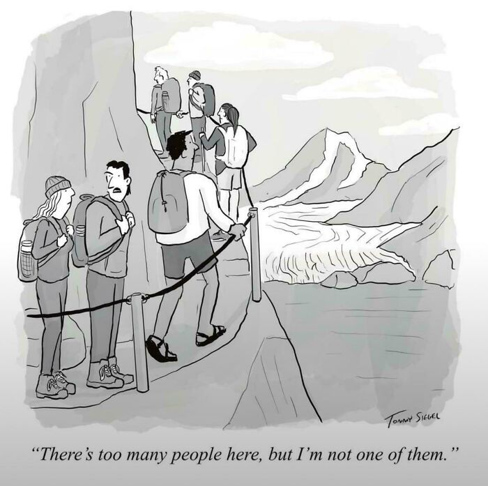 A cartoon of hikers on a narrow mountain path, with one explaining the joke about too many people.
