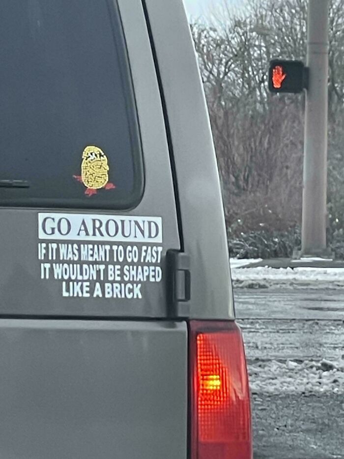 Van bumper sticker humorously advising to go around shaped like a brick