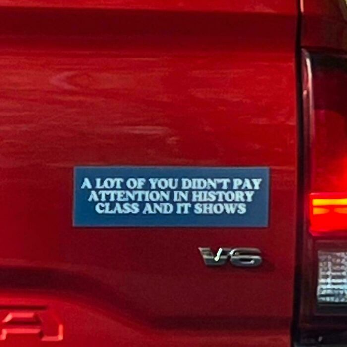 Bumper sticker on red truck about paying attention in history class