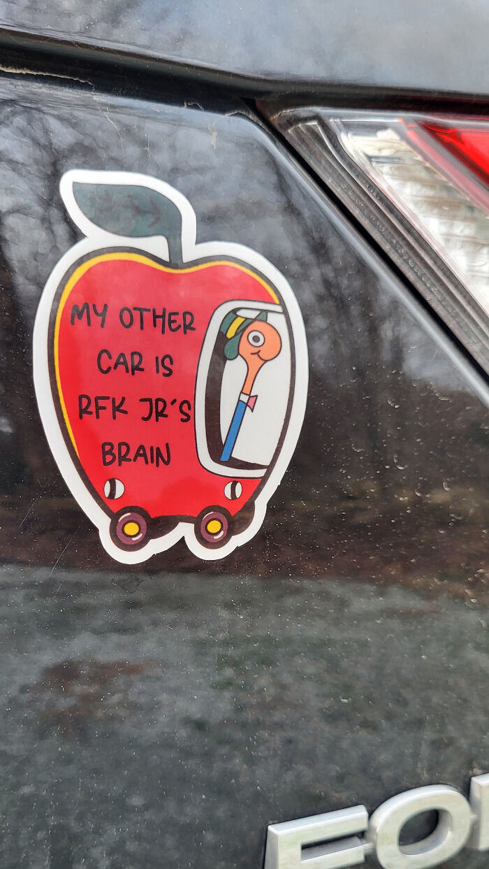 Car sticker showing an apple with text about RFK Jr's brain