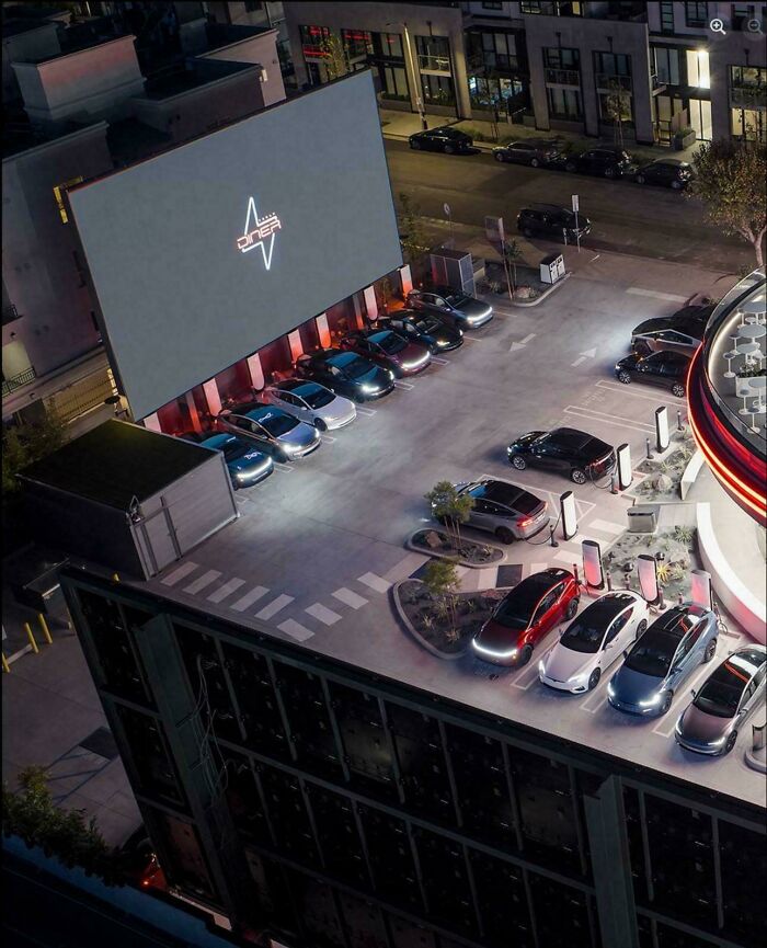 Aerial view of a sleek modern parking lot with cars lined up, creating a misleading and confusing photo illusion.