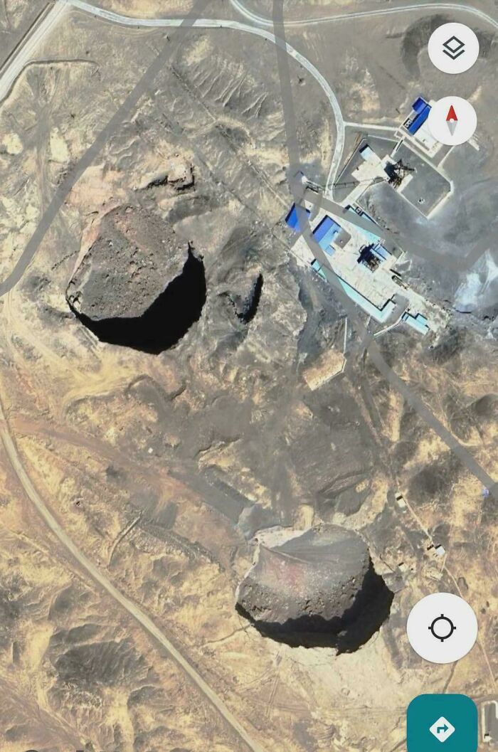 Aerial view of misleading and confusing photos showing large crater-like formations near industrial buildings.