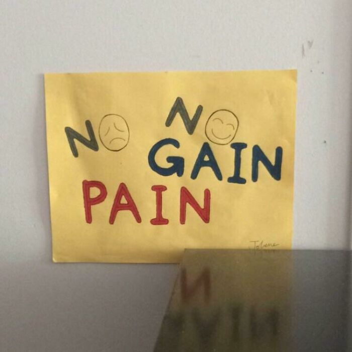 Handmade sign with the phrase No Gain Pain and smiley faces showing comedic gold from signs that went wrong.