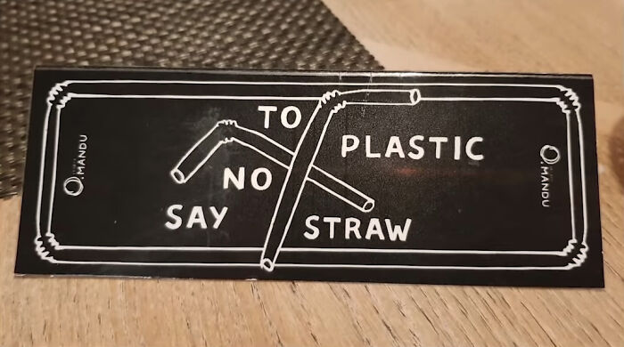 Sign with bent straws illustrating comedic gold from signs that went wrong, warning against plastic straws.