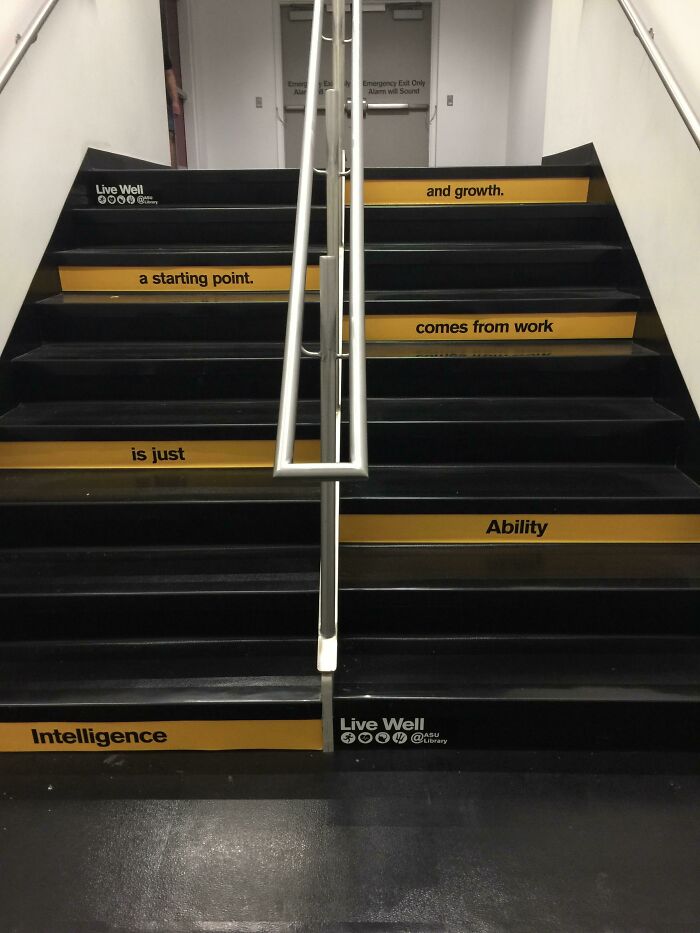 Staircase with motivational words arranged so confusingly it looks like a comedic sign fail from signs that went wrong.