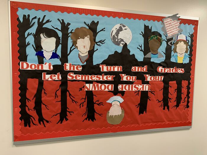 School bulletin board sign with words upside down and cut-out characters, a funny example of signs that went so wrong.