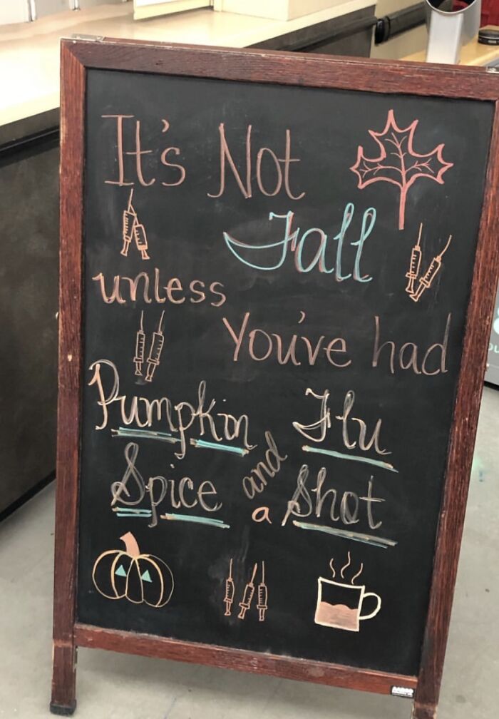 Chalkboard sign with a fall message mixing pumpkin spice and flu shot humor, a sign that went wrong with comedic gold.
