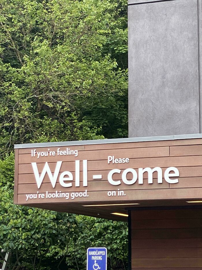 Sign with humorous spelling error in welcome message, an example of signs that went so wrong and became comedic gold.