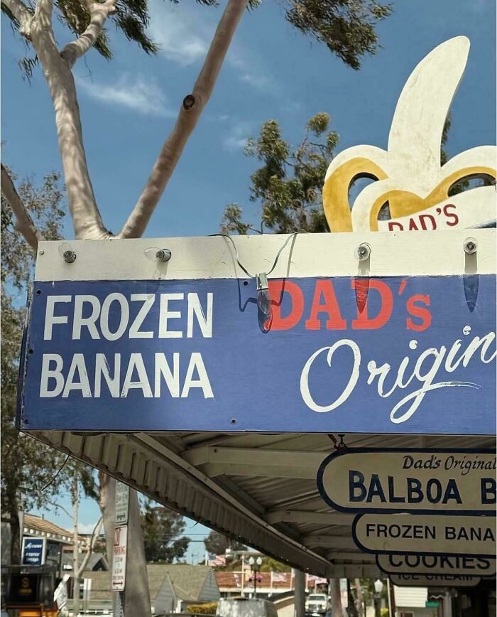 Funny frozen banana shop sign with a giant banana sculpture, showcasing signs that went so wrong into comedic gold.