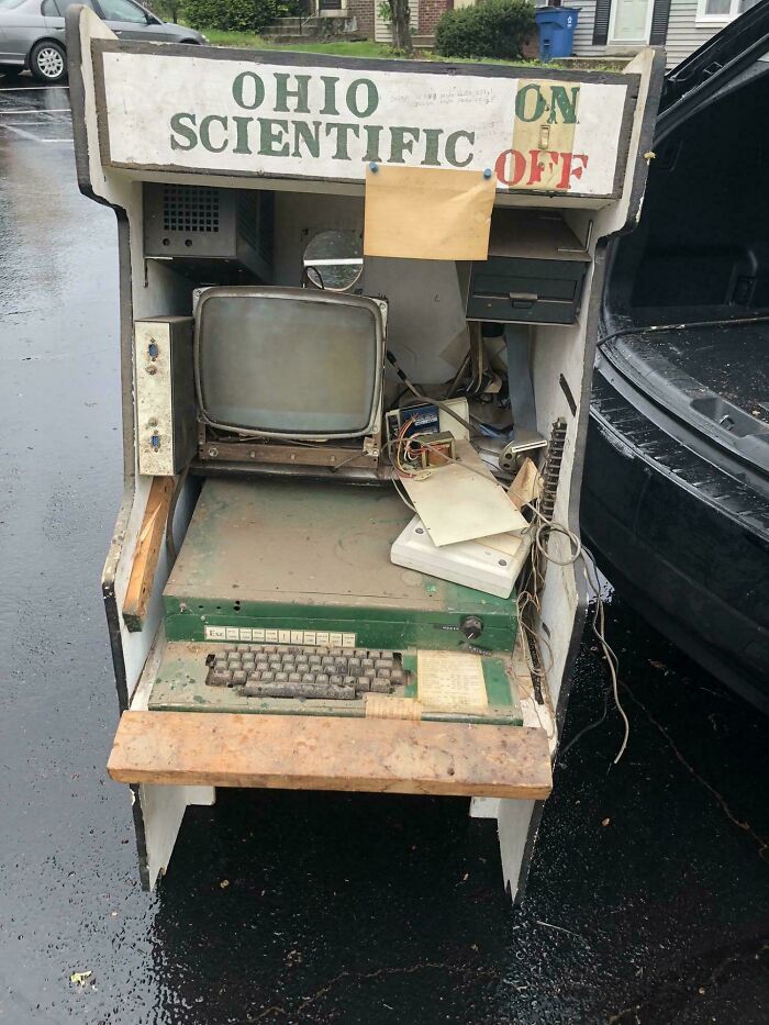 Old broken Ohio Scientific computer setup found outdoors, a funny example of signs that went wrong turning into comedic gold.