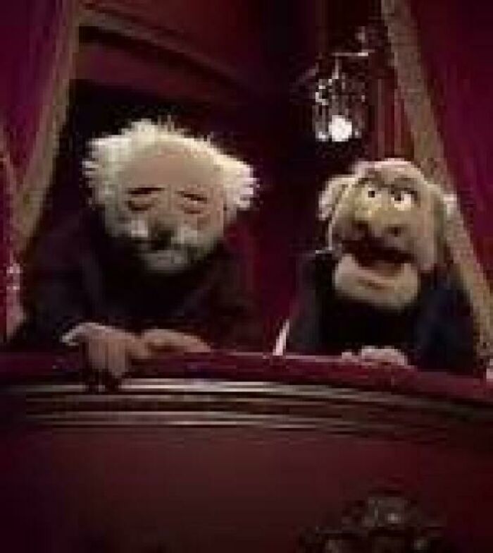 Statler and Waldorf, two Muppets, watching from a balcony, taking you way back and reminding you how old you are.
