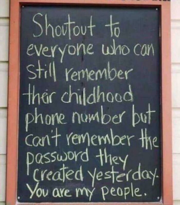 Chalkboard sign with a witty message about remembering old phone numbers, reminding you how old you are with relatable humor.