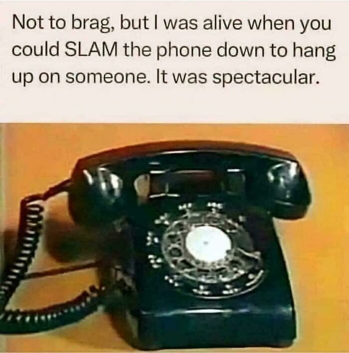 An old black rotary telephone, a clear image that takes you way back to when you could slam down the phone.