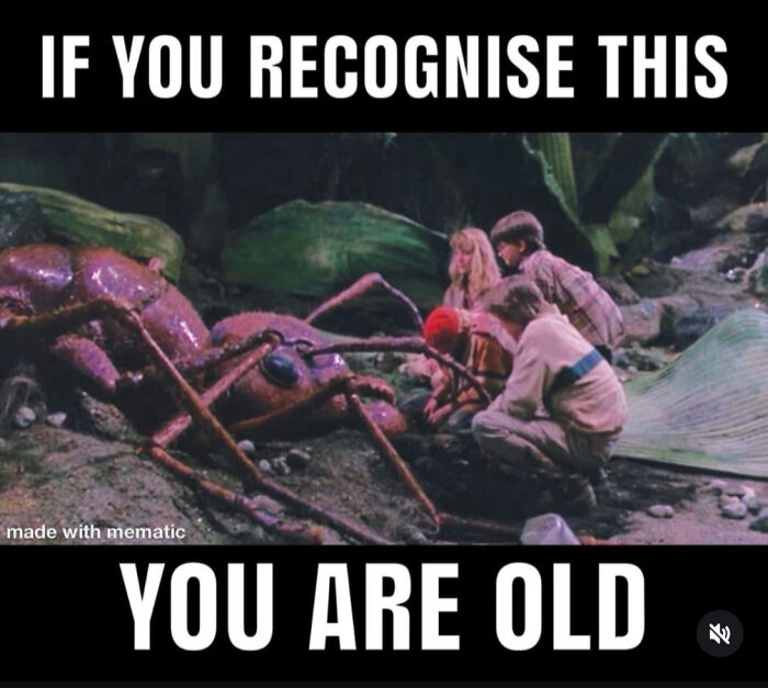 Children next to a giant ant in a scene from Honey, I Shrunk the Kids, taking you way back.