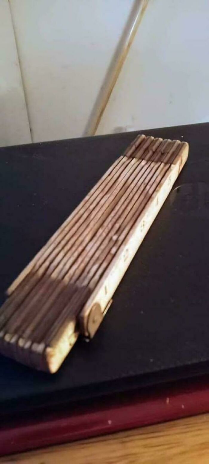 A vintage wooden folding ruler, an old tool that might take you way back and remind you how old you are.