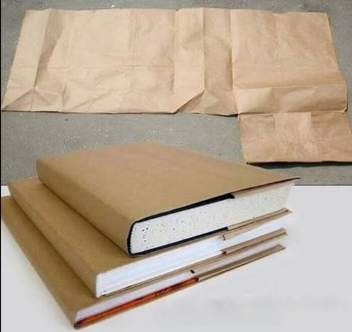 Stack of textbooks covered in brown paper bag, a classic school memory that reminds you how old you are.