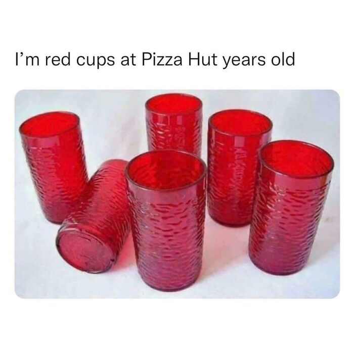 Several iconic red Pizza Hut cups, taking you way back to memorable dining experiences.