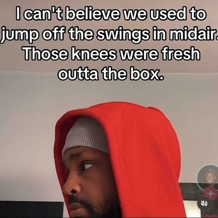 Man wearing a red hoodie reflecting on painful relatable memories about childhood and fresh knees memes.