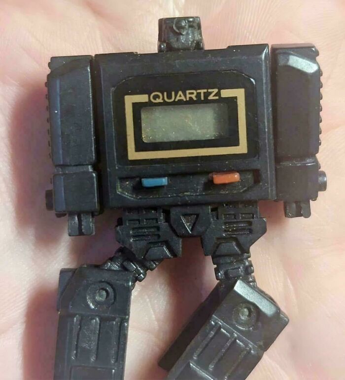 Close-up of a vintage quartz watch robot toy nostalgic for Gen X collectors and retro enthusiasts.