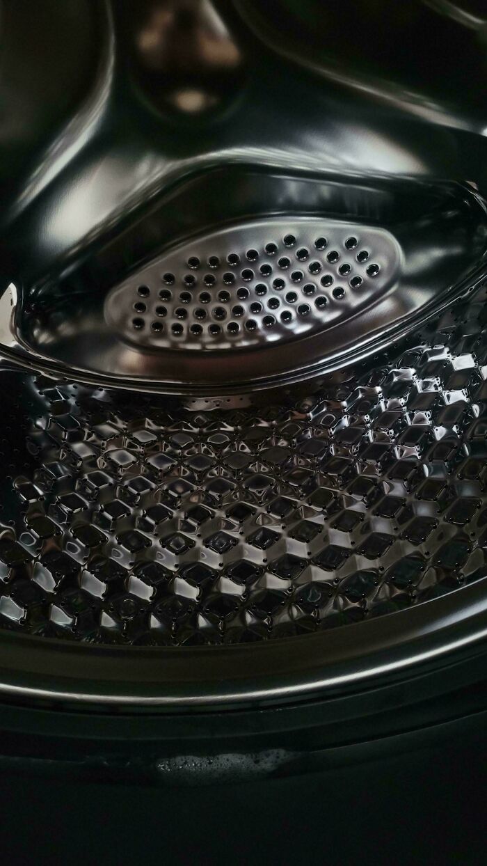 Close-up of a shiny metal surface with perforations demonstrating perfect camouflage in everyday objects.