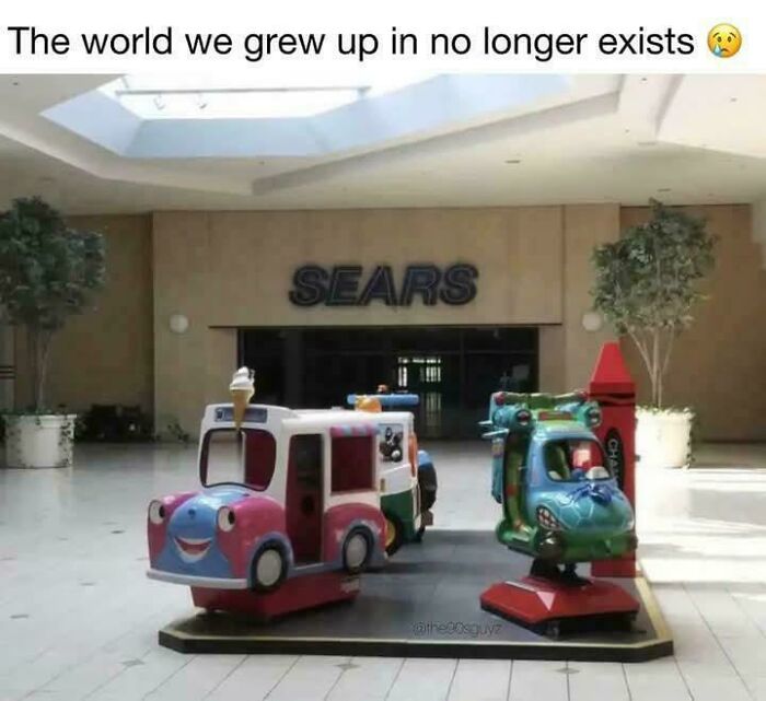 Empty mall area with vintage kid ride-on toys outside a closed Sears store, evoking 90s nostalgia and childhood memories.