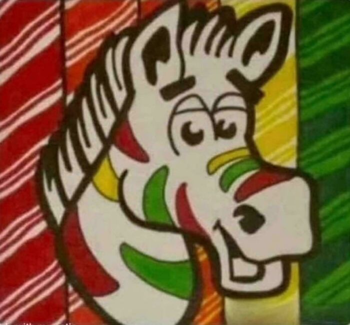 Colorful animated zebra with a smiling face against a striped background, evoking ’90s nostalgic memories for kids today.