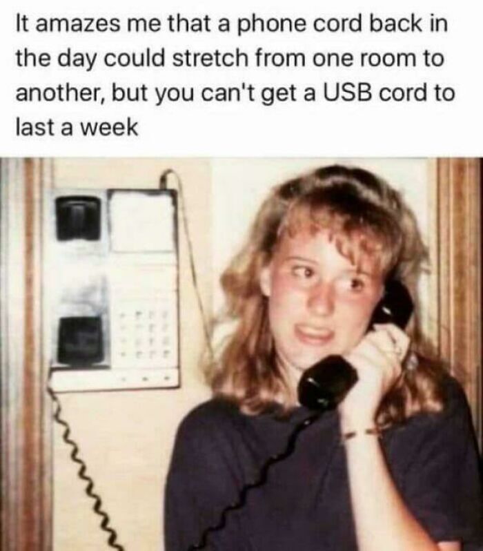 Teen girl holding a corded phone, nostalgic 90s memory about phone cords lasting longer than USB cords.