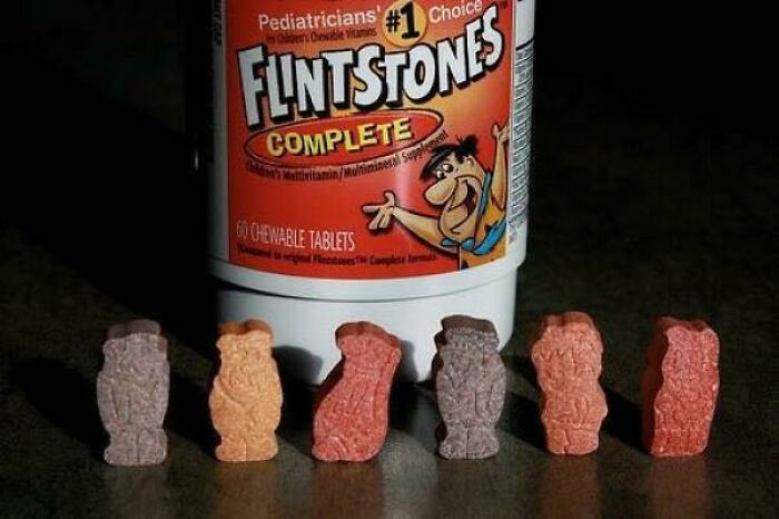 Flintstones Complete chewable vitamins shaped like characters, a nostalgic '90s kids favorite supplement bottle and tablets.