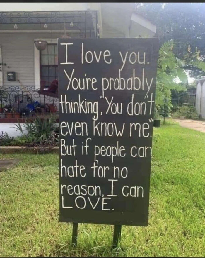 Wholesome love message on yard sign about choosing love over hate