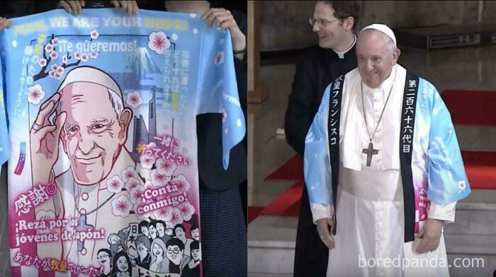 Pope Francis wearing a colorful blue robe with Japanese text and cherry blossoms