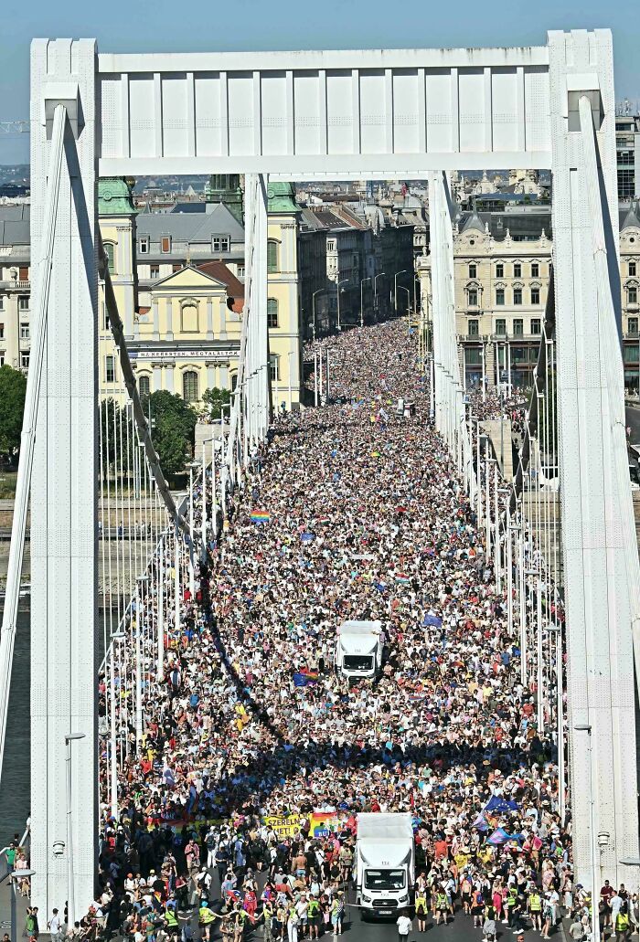 Large crowd filling a bridge during a peaceful wholesome public event