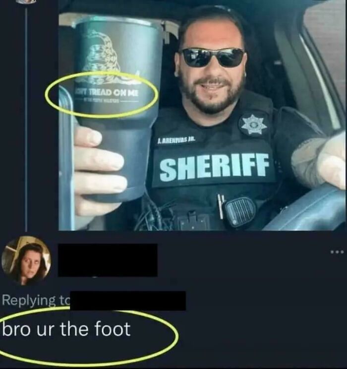 Sheriff smiling in car holding cup with Don't Tread On Me logo, paired with sharp comeback comment "bro ur the foot."