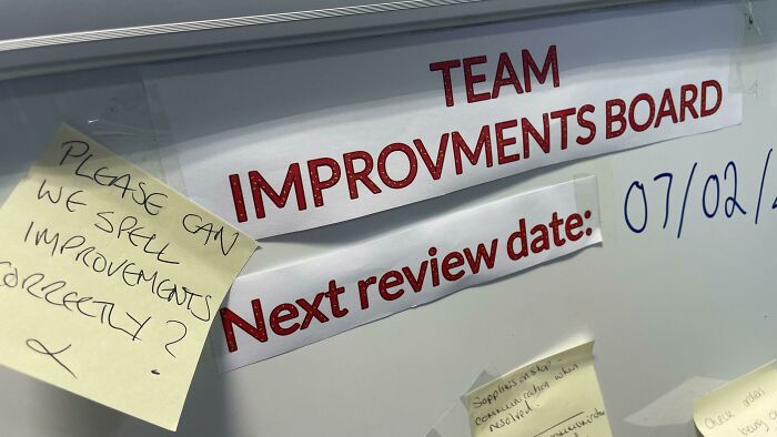 A passive-aggressive note on a whiteboard, asking to spell improvements correctly on the team improvements board.
