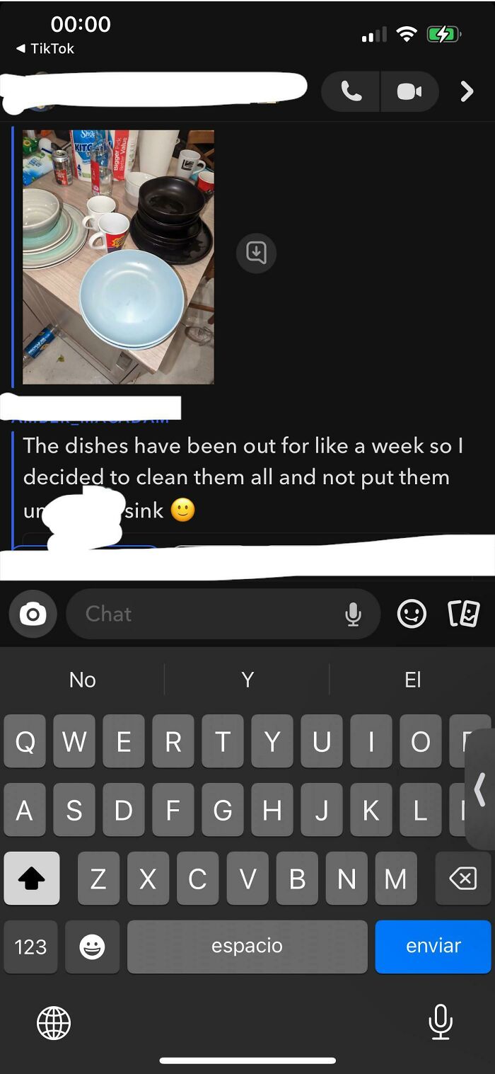 A screenshot of a text message with a passive-aggressive note about dirty dishes being cleaned but not put away.