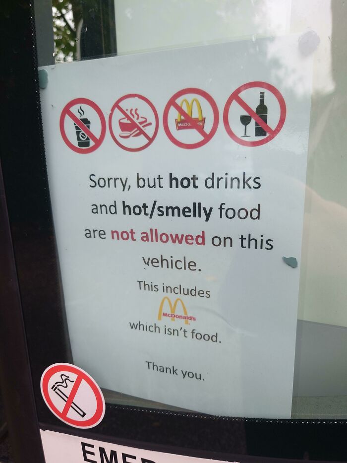 A sign with a passive-aggressive note about food and drinks not allowed on a vehicle, a classic for petty people.