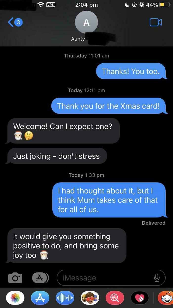 A screenshot of passive-aggressive notes in a text message conversation about Christmas cards.