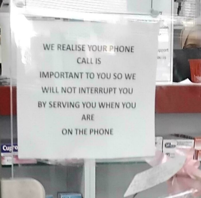 A passive-aggressive note stating service will not be provided to people on the phone.