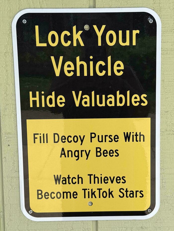 Funny warning sign about angry bees used as decoy to deter thieves and protect valuables from being stolen.
