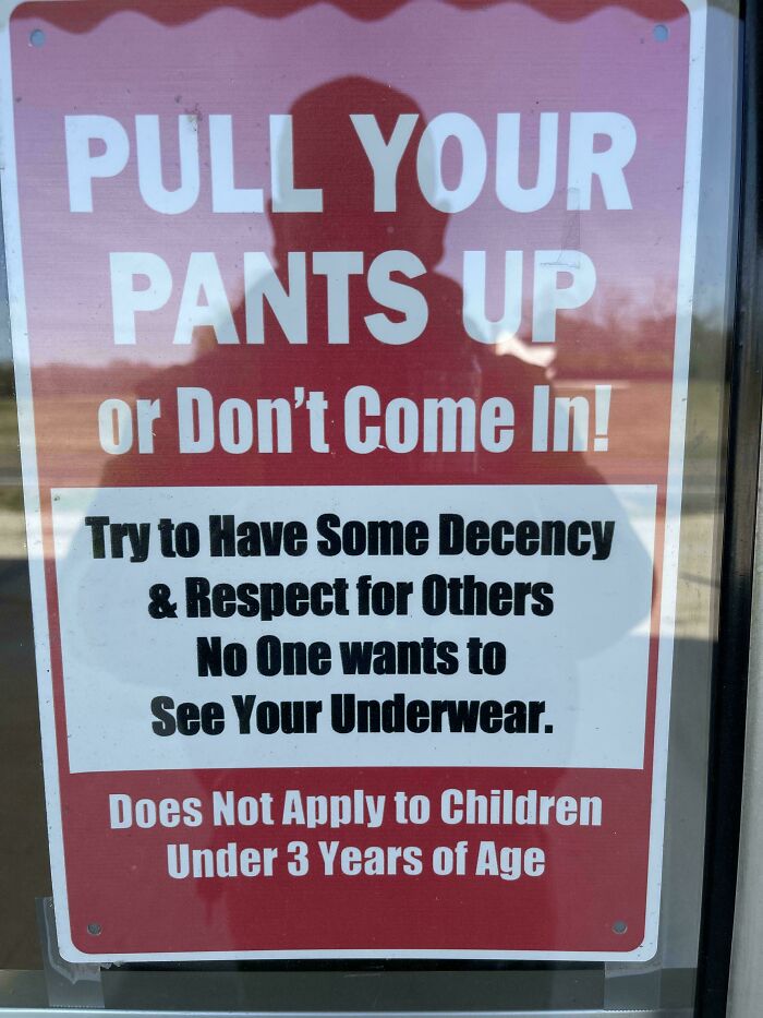 Funny and confusing sign about pulling pants up for decency, featured in there are bees signs collection.
