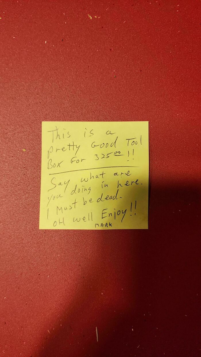 A yellow sticky note on a red background with a humorous message about a tool box, relevant to dads and feel-good posts.