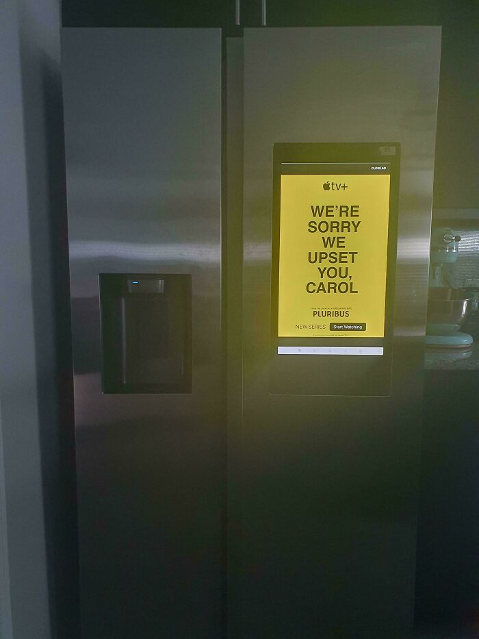 Smart refrigerator screen displaying a personalized advertisement, illustrating design that feels genuinely evil in modern ads.