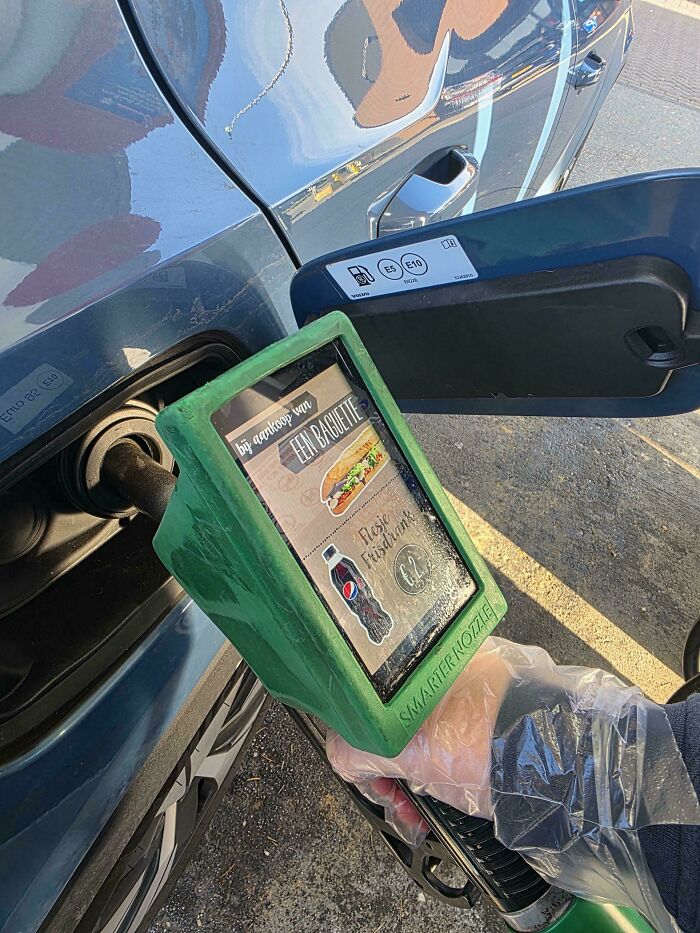 Car gas pump displaying an advertisement screen, illustrating design that feels genuinely evil with ads on a car.