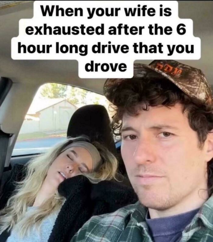 Man taking a selfie beside his exhausted wife asleep after a long drive, relatable life memes hitting close to home.