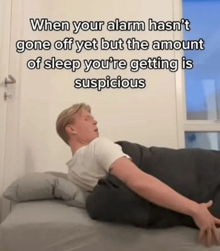 Person in bed looking suspicious about the amount of sleep, relatable meme from posts and memes about our lives.